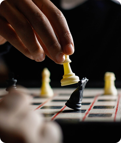 Hand moving chess piece